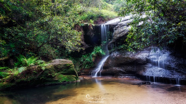 A waterfall located in the midst of the scenic Blue Mountains.