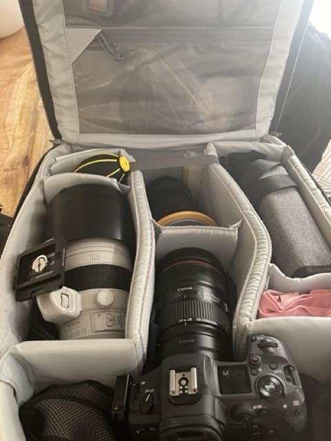 A camera bag filled with landscape photography gear.