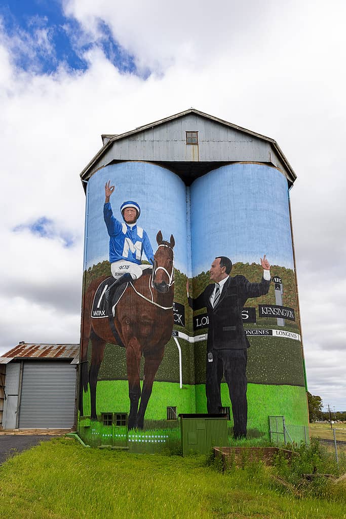 A painting of a horse and man on a silo in order to plan the perfect photography trip.