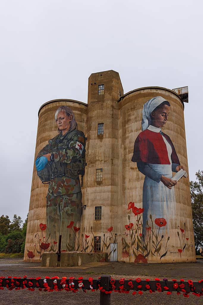 A large silo featuring a soldier and a woman, perfect for photography.