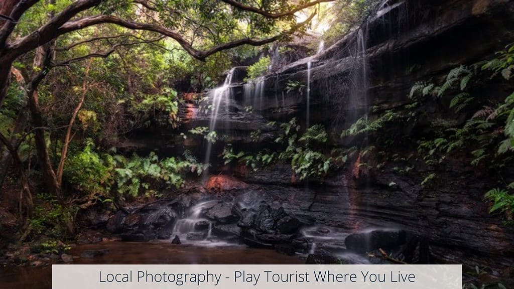 A waterfall with the words local photography play tours where you live.