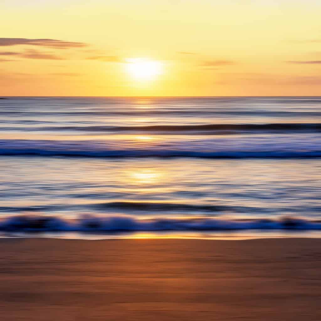An image of a sunrise on a beach inviting you to enjoy the view - it's not all about getting great photos